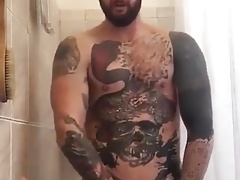 Tatted Hunk Fucks Dildo in Shower Until He Cums