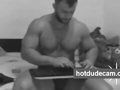 Sexy hunk alone in his bedroom