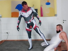 Muscle Man Tries On Spandex Cosplay Suit With The Help Of His Muscle Daddy
