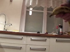 crossdresser transvestite in the hitchen stuffs his ass with