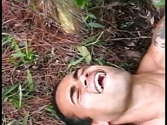 Young Latino gets drilled by a gay stud lying on a tree trun