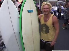 Surfer in need of cash finds himself in between two cocks