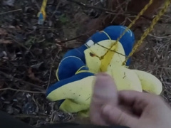 blue dinosaur Joy i urinating in woods