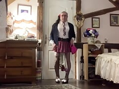 In a schoolgirl-style outfit with a little fuchsia pink skirt for a night out