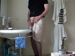 Demurely clad crossdresser stroking and spunking