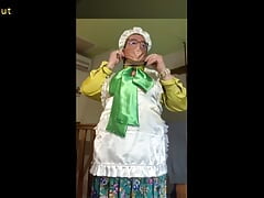 In boniche outfit, put on agag, a satin mask and iron the ribbons