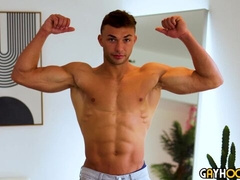 Dallas Blue strokes his meaty member for the cam