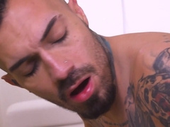 Latino is toyed with while toyed by by a tall hunk