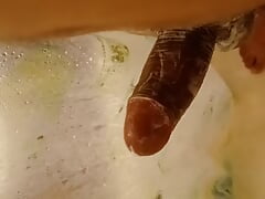 man ejaculates in the bathroom