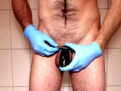 Nettle punishment for the submissive twink slave in a chastity cage