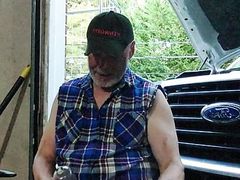 Mechanic relaxing at end of work day